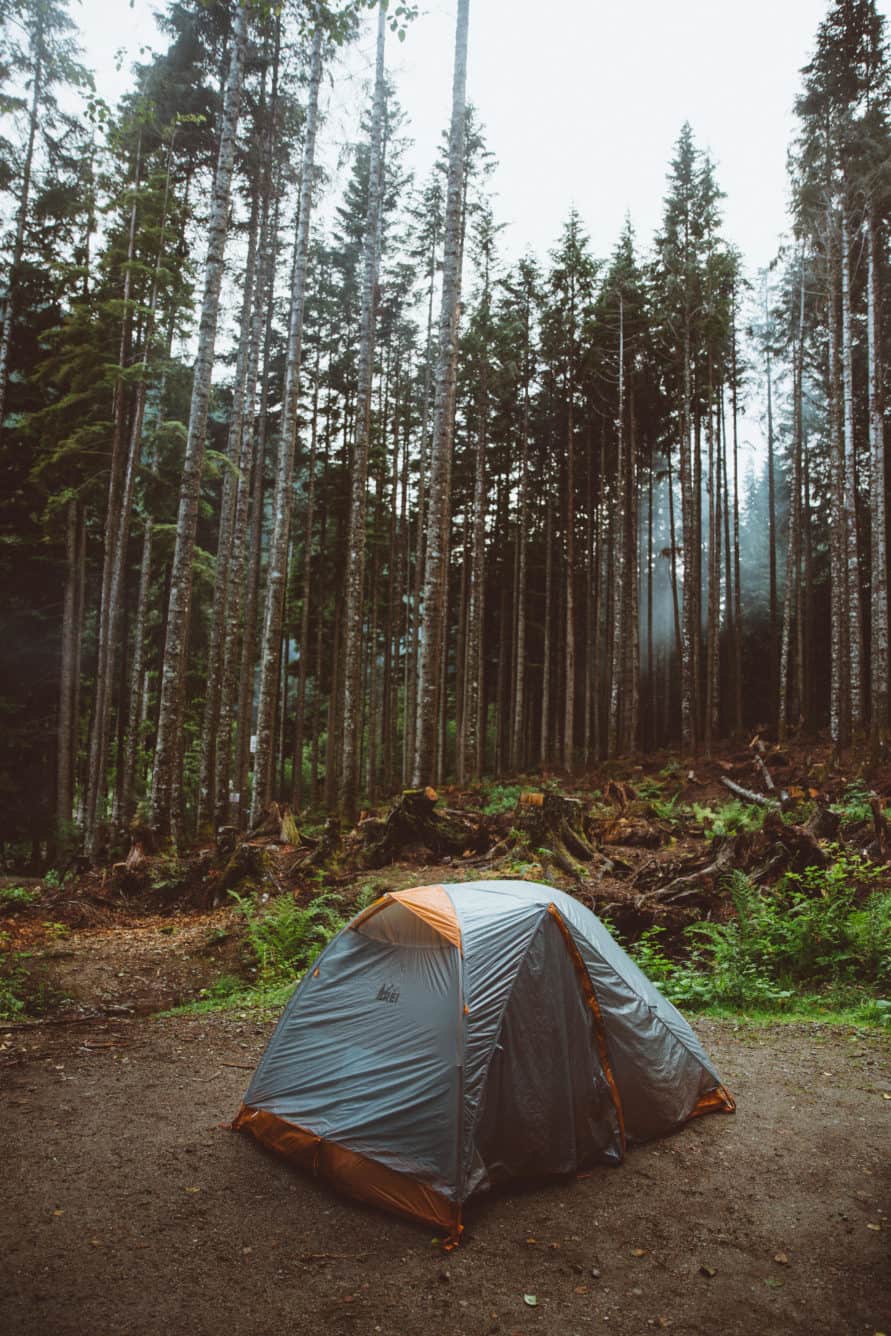 Are you ready for surviving camping in the rain? We've done it in the Pacific Northwest numerous times and we're sharing all our secrets!