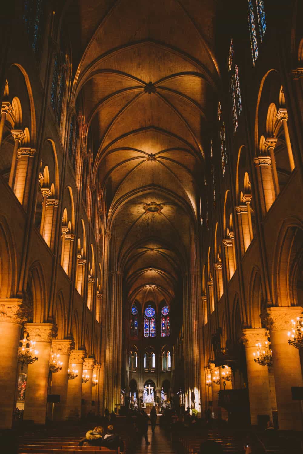 Inside Notre Dame - Discover the best photography spots in Paris, France in this all-inclusive post! We're including iconic favorites like the Eiffel Tower and Champs Elyssse, but also hidden gems like Saint Chapelle and Musee d'Orsay Clocks. Find the best Instagram spots in Paris here! #paris #france #eiffeltower #photography #french #instagram #laduree #champselysees #museedorsay #arcdetriomphe #louvre #macaron #europe