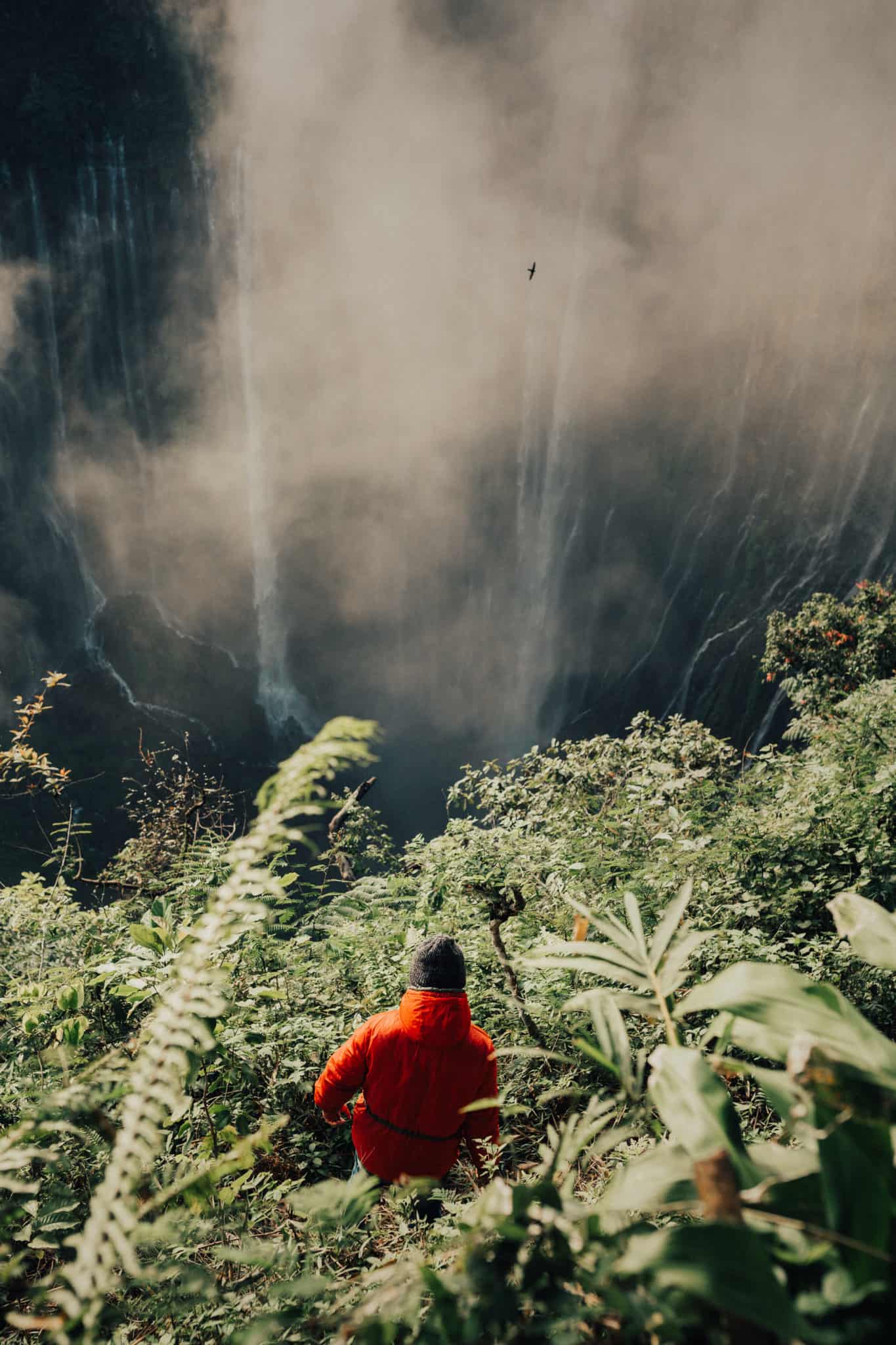 Zahirii standing in from of Tumapk Sewu Waterfall