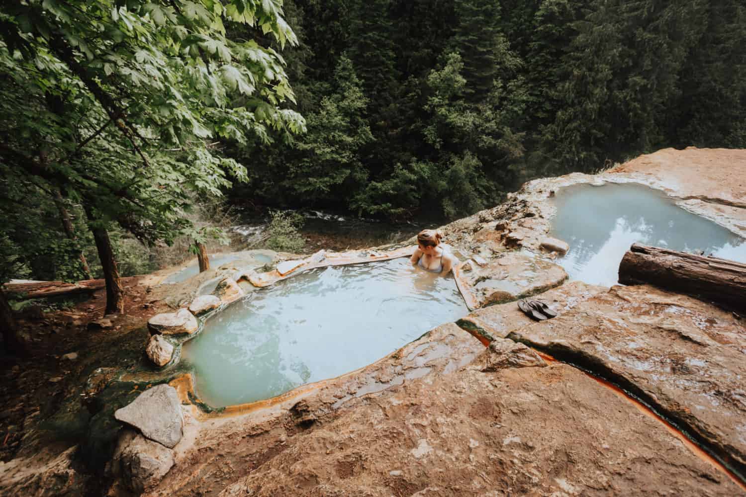 Emily sitting in Umpqua Hot Springs