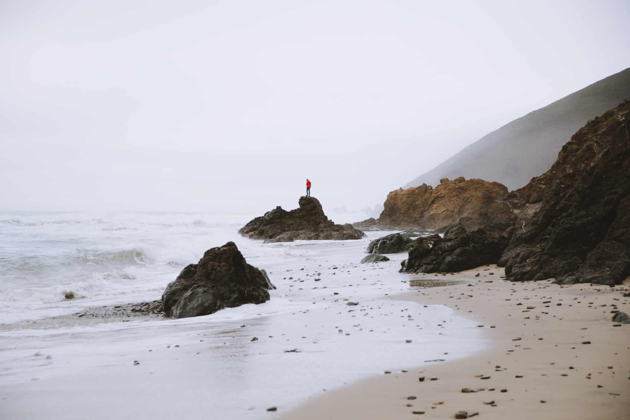man standing on rock Pfeiffer Beach Big Sur California
