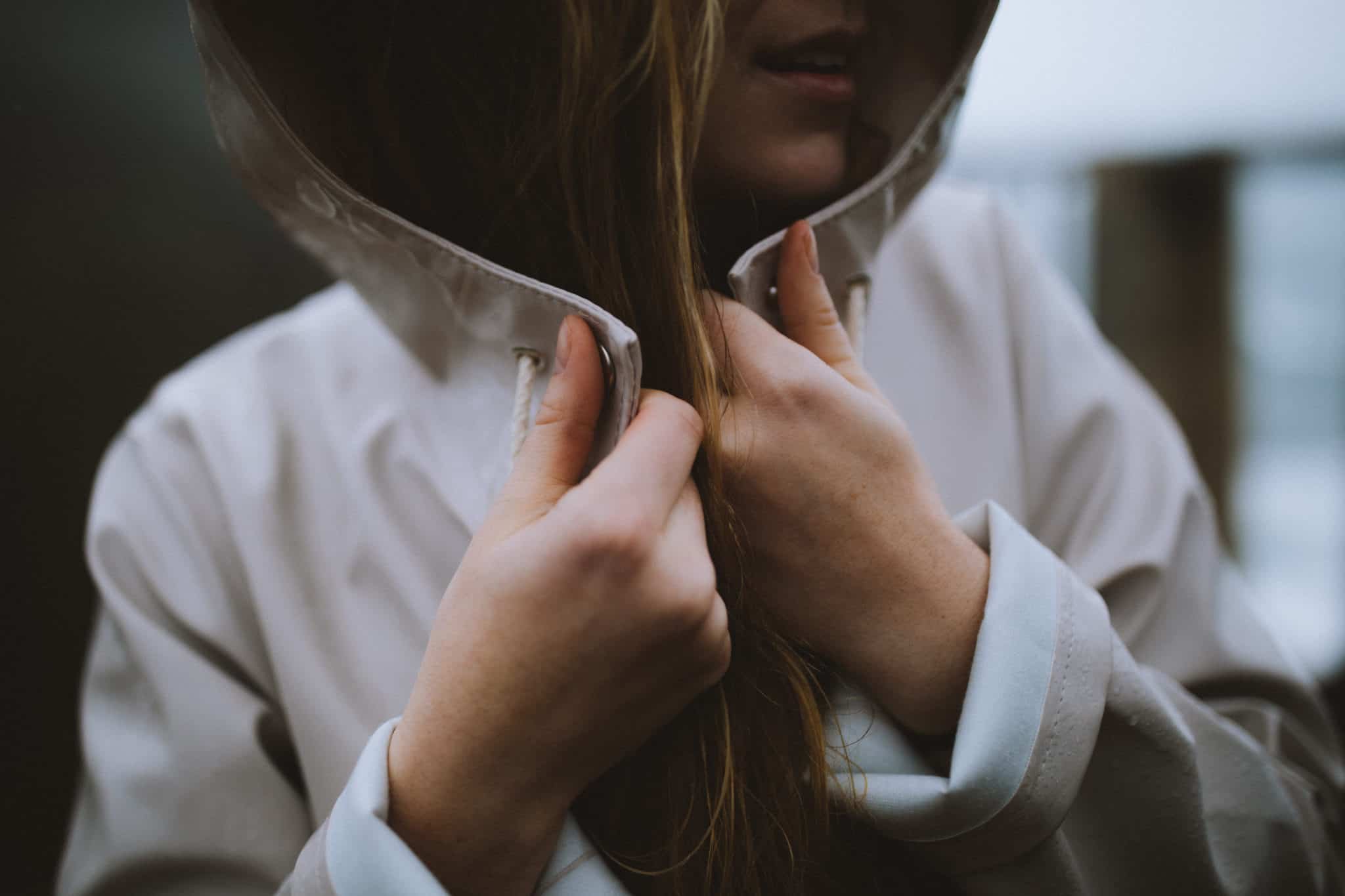 Emily wearing stutterheim moosebacke rain jacket in light sand near Bixby Creek Bridge Big Sur California