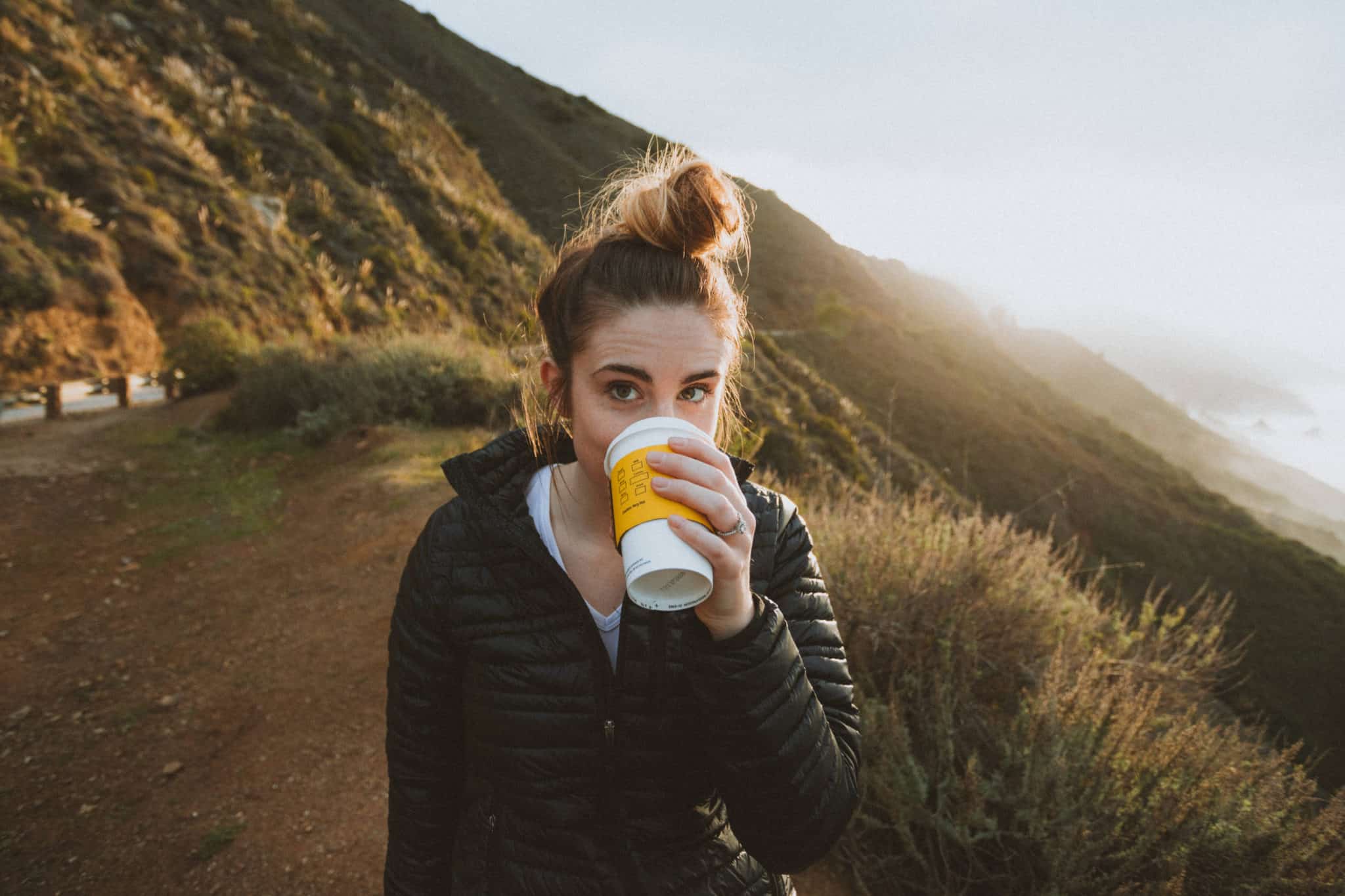 woman drinking coffee big sur california