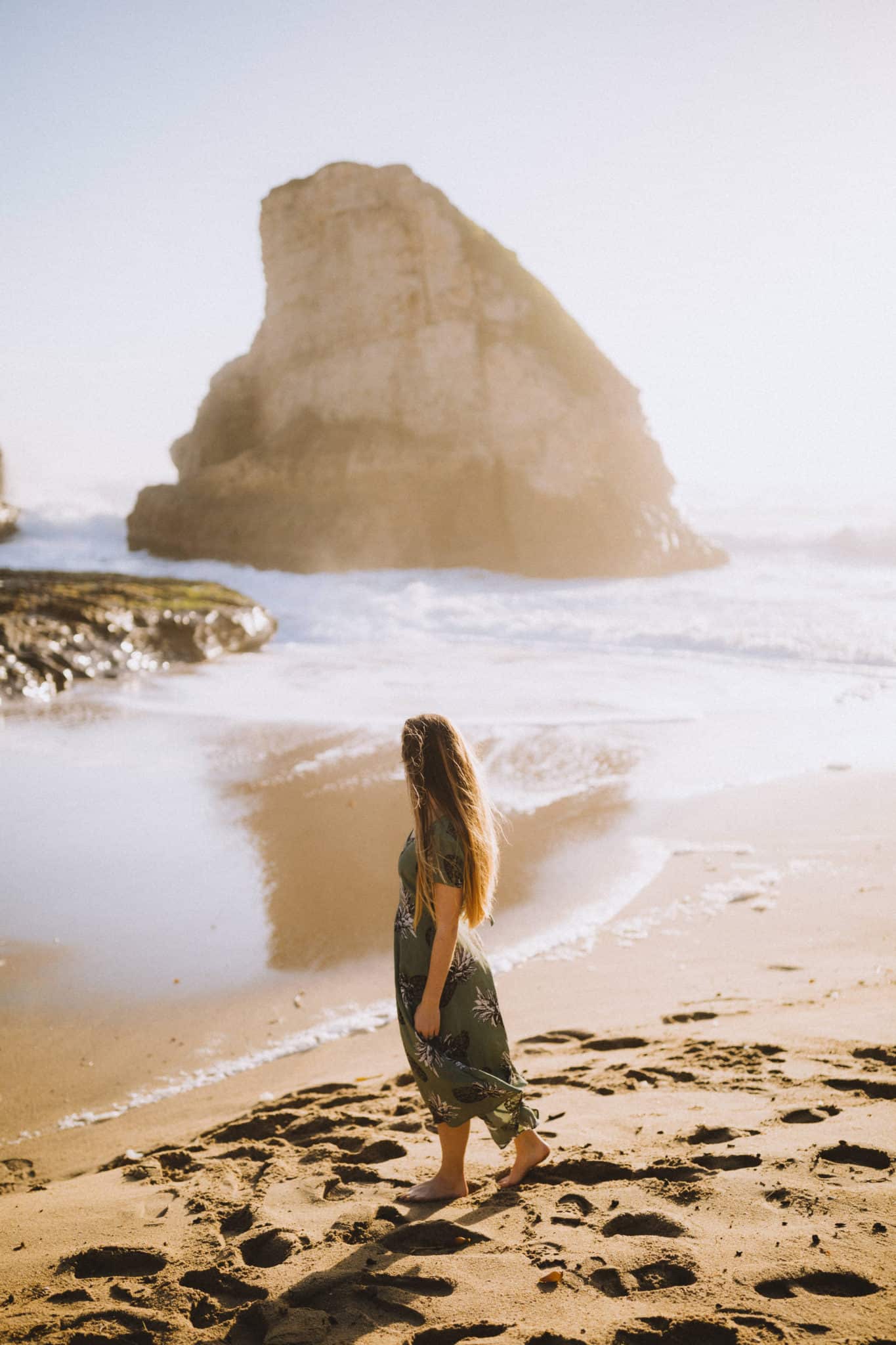 Emily standing at Shark Fin Cove Beach California
