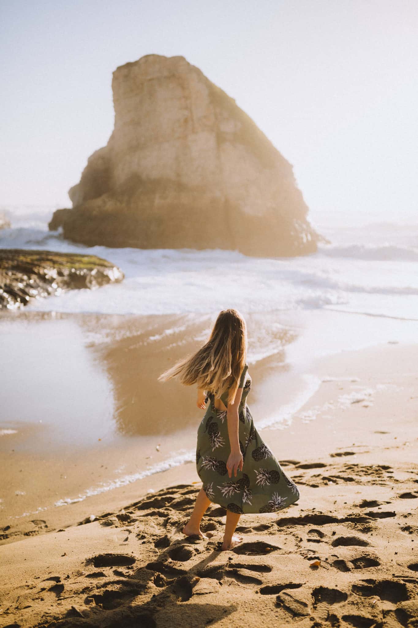 Emily standing at Shark Fin Cove Beach California