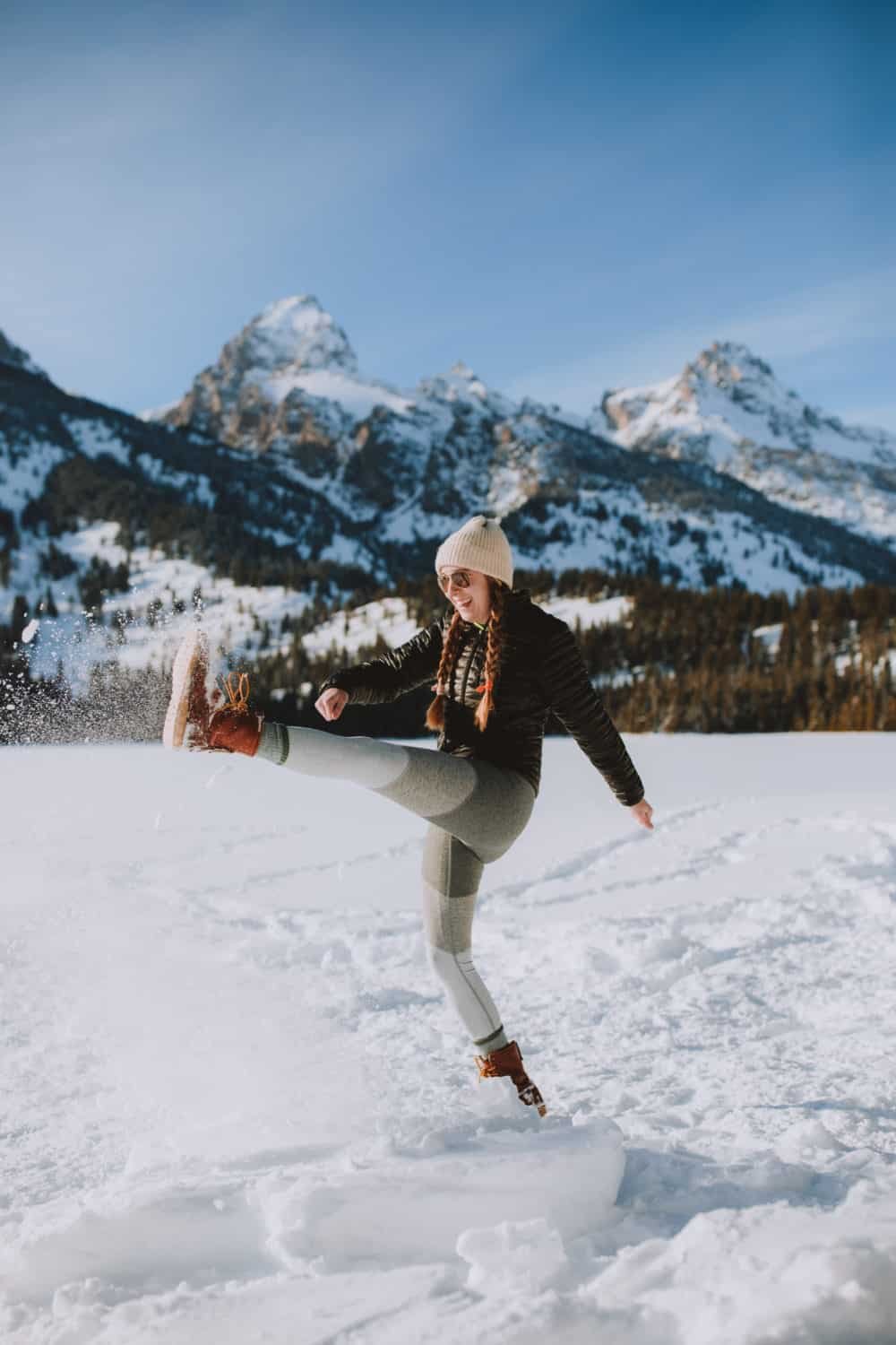 Emily Mandagie kicking snow at Taggart Lake Trail in Grand Teton National Park - TheMandagies.com