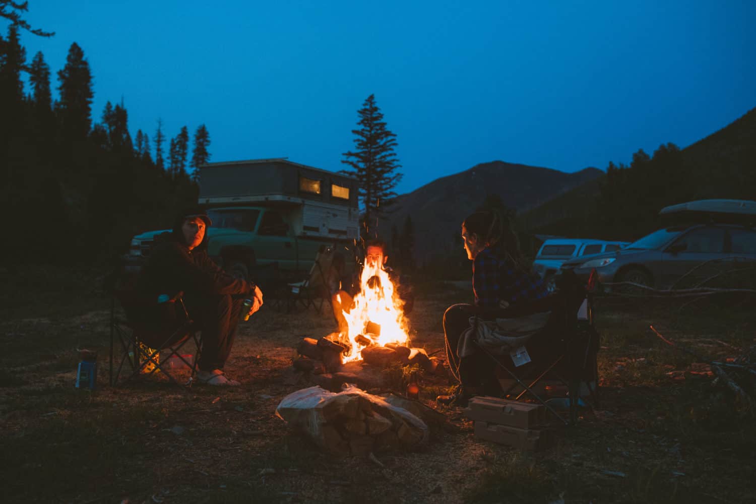 Sitting by the fire while camping for free