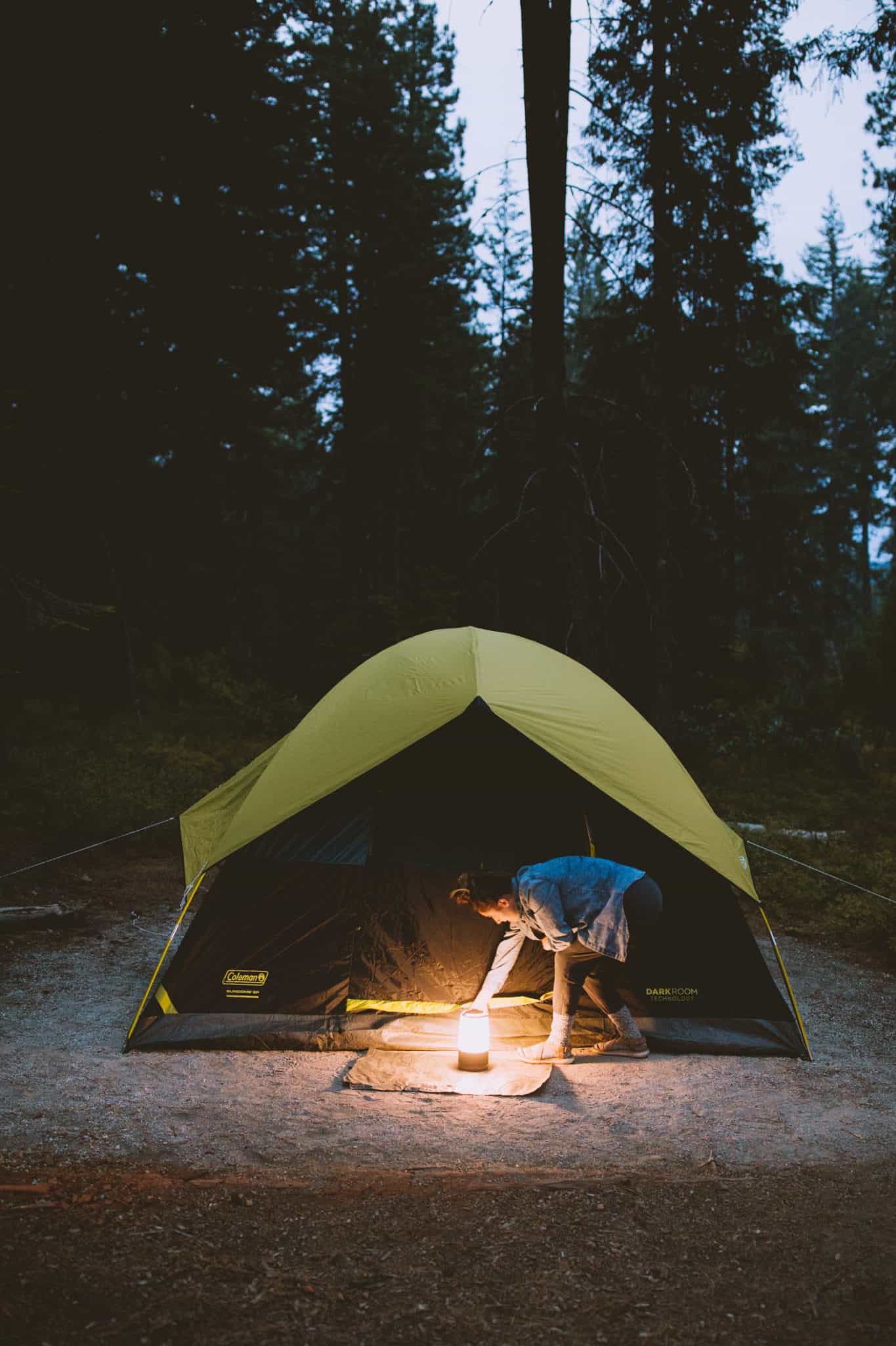 Camping tent at night with lantern