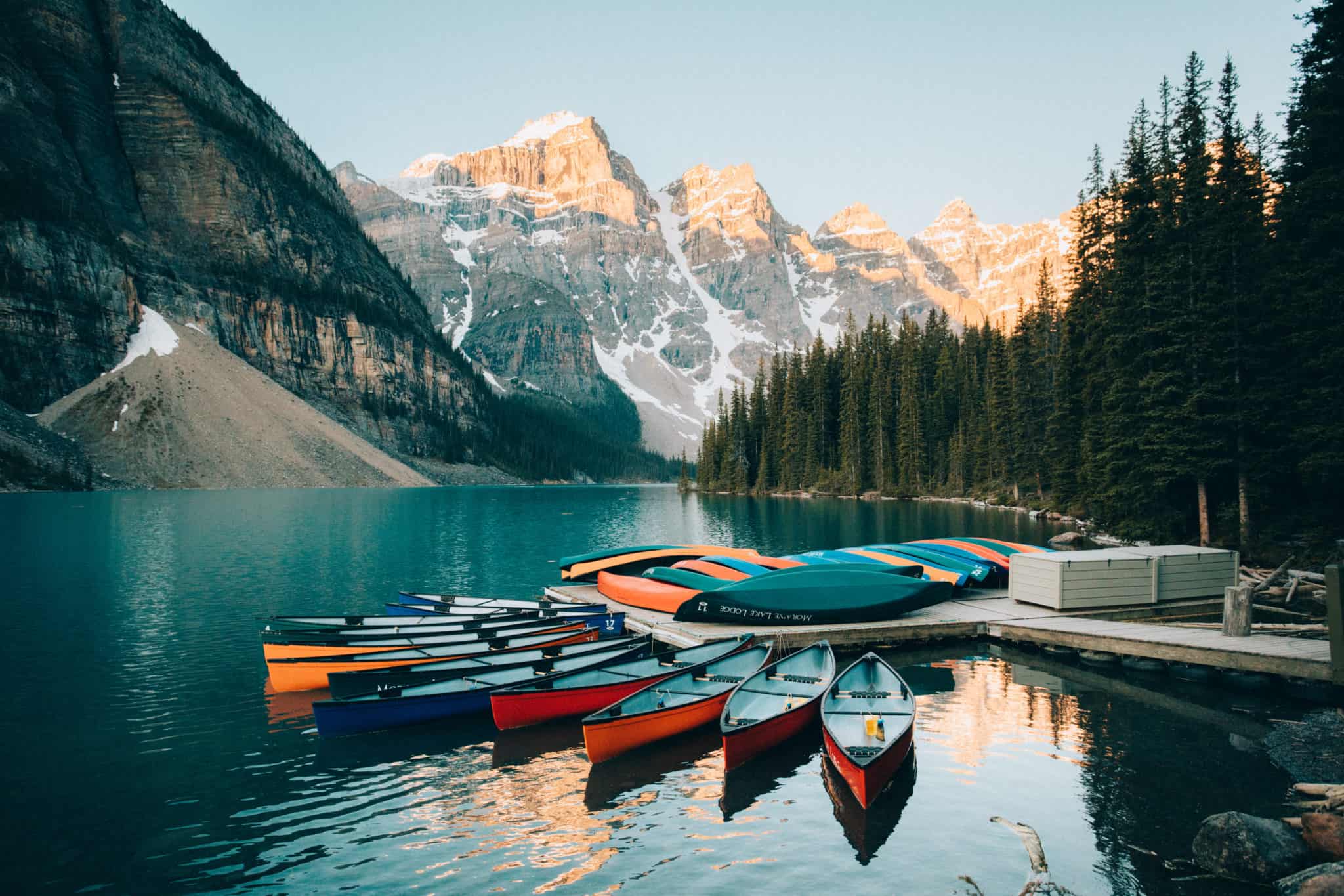 Colorful canoes and Moraine Lake Boat Rental Dock, Banff National Park