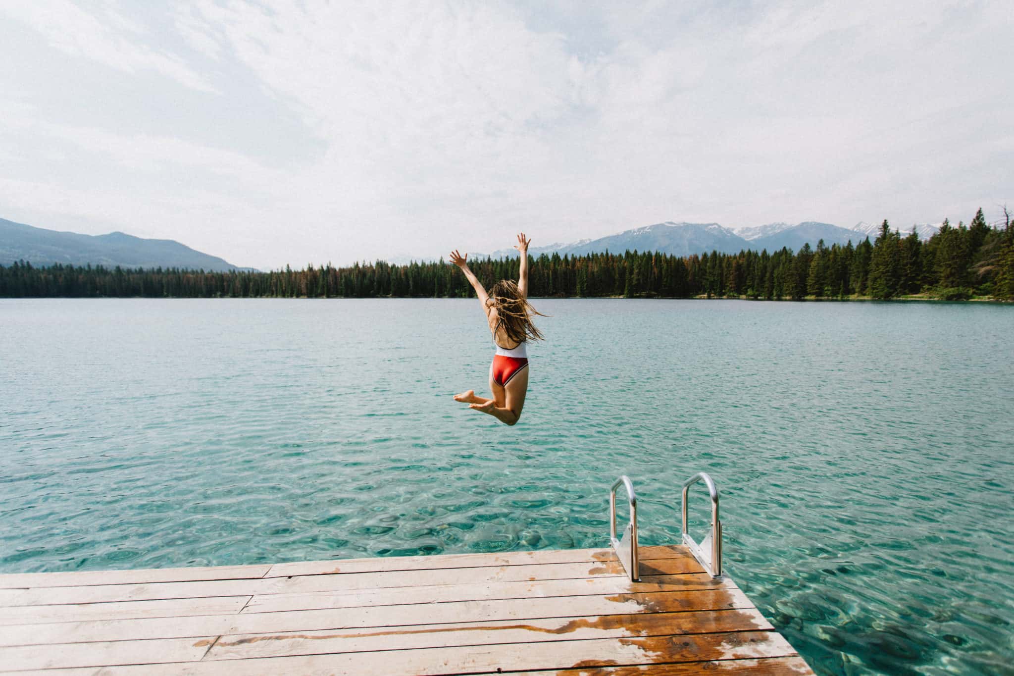 Emily jumping into Lake Anette, Jasper National Park