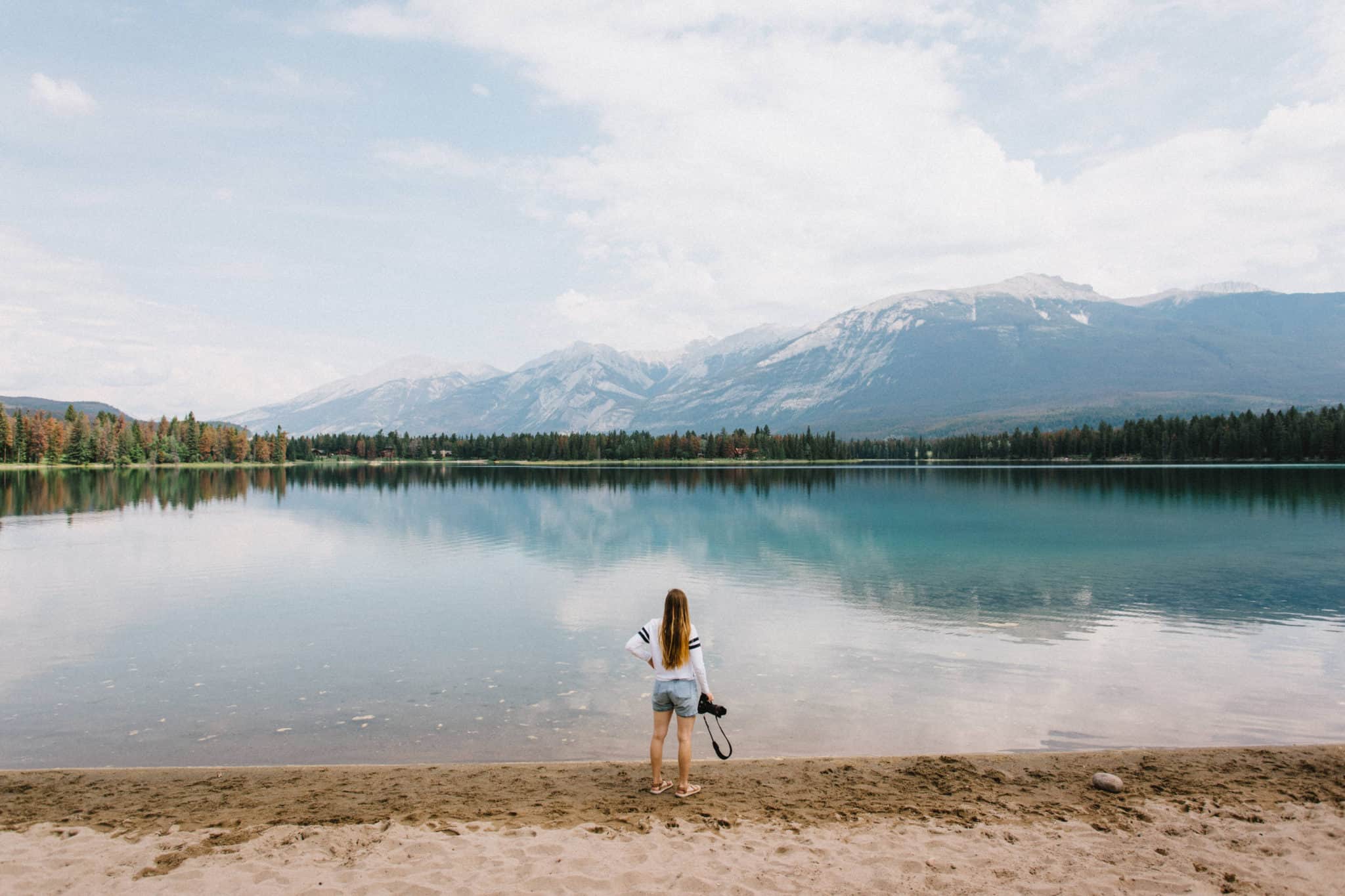 Emily Mandagie standing at Lake Edith Shore - Jasper National Park