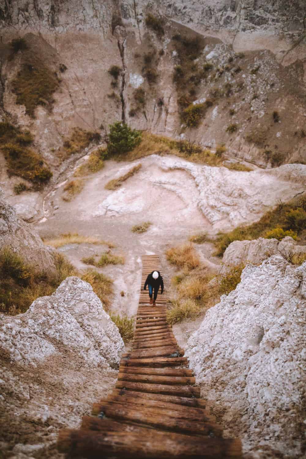 Emily hiking Notch Trail stairs South Dakota