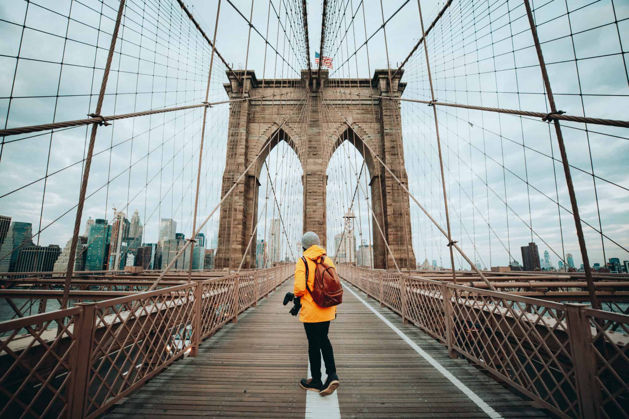 Berty Mandagie standing on Brooklyn Bridge, NYC