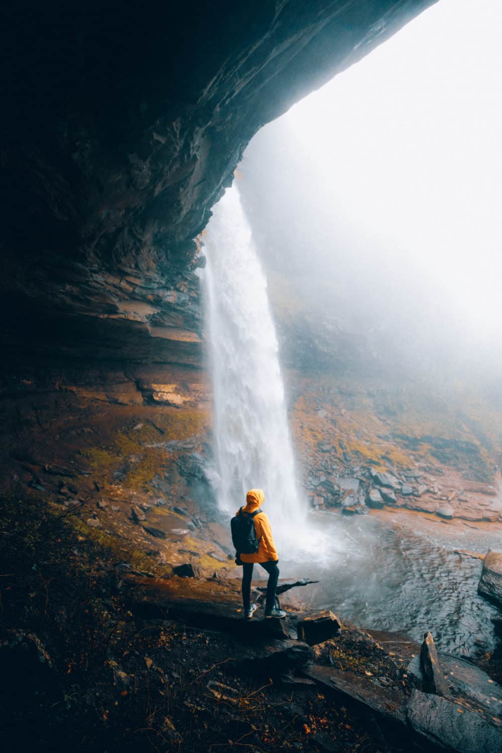 Berty standing under Kaaterskill Falls in Upstate New York