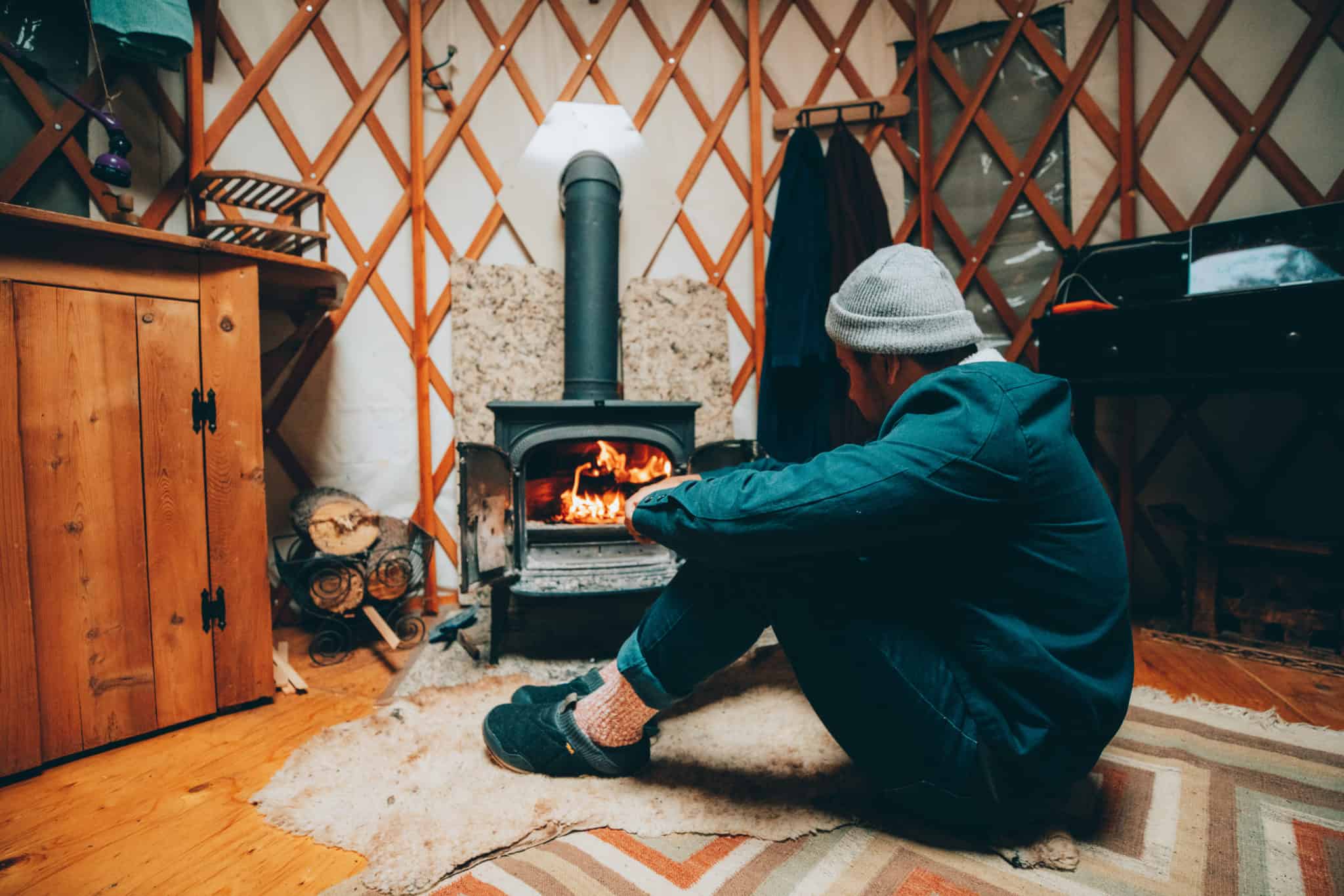 sitting by the fire in a yurt