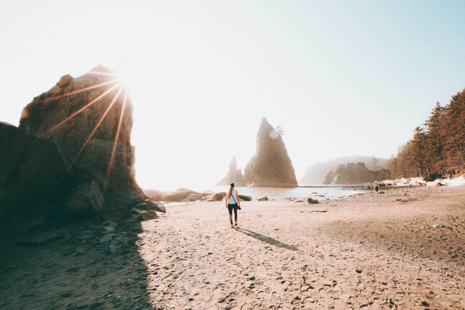 Emily Mandagie walking on Rialto Beach, Olympic National Park - TheMandagies.com