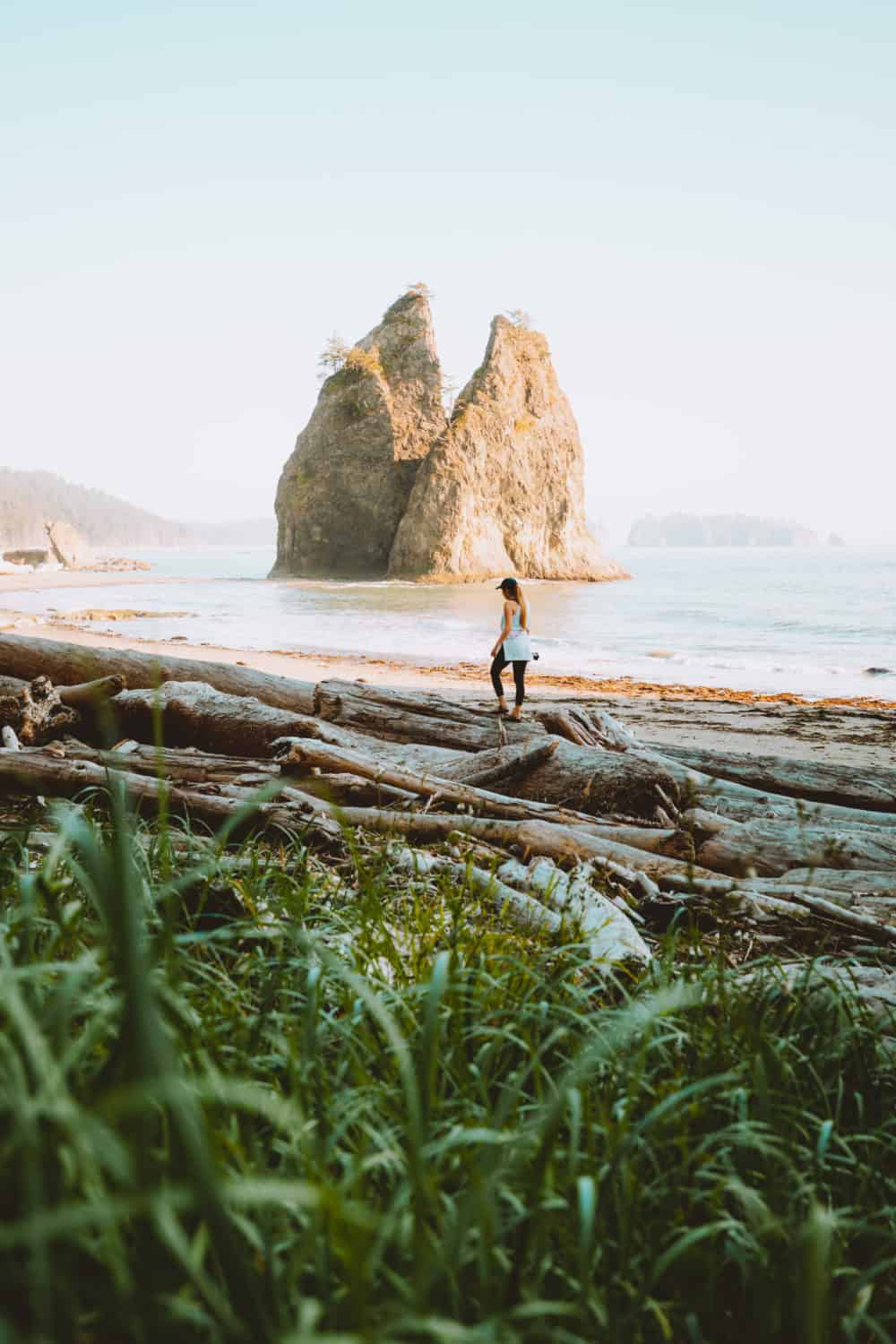 Emily Mandagie standing next to Sea stacks at Rialto Beach, Olympic National Park
