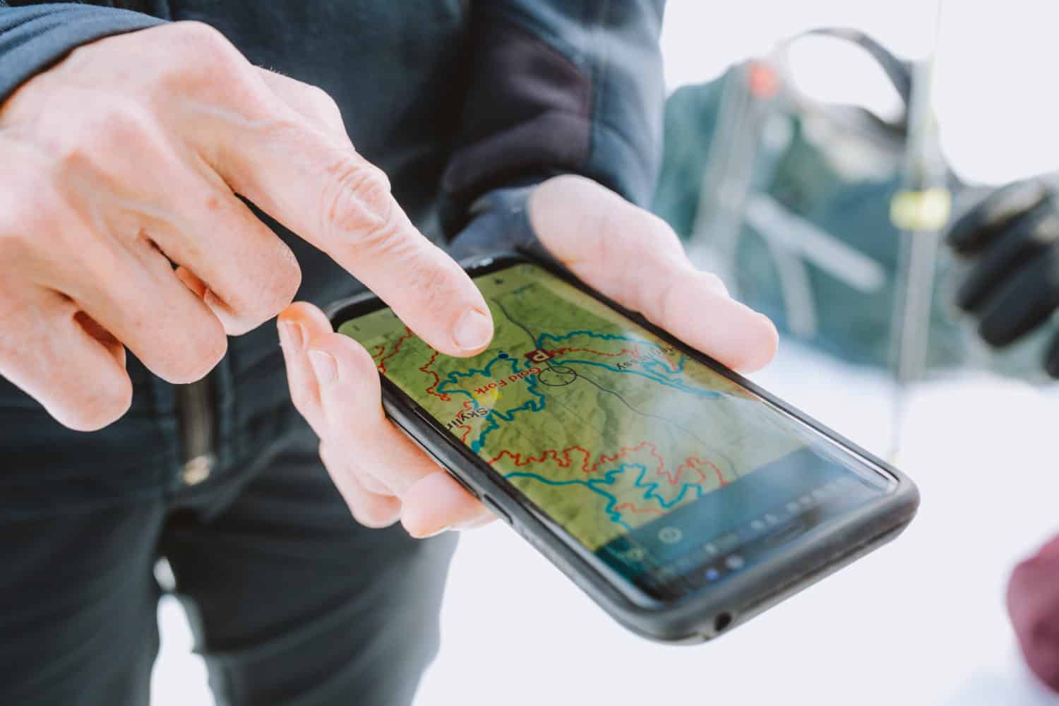 Smartphone showing trail map app Avenza