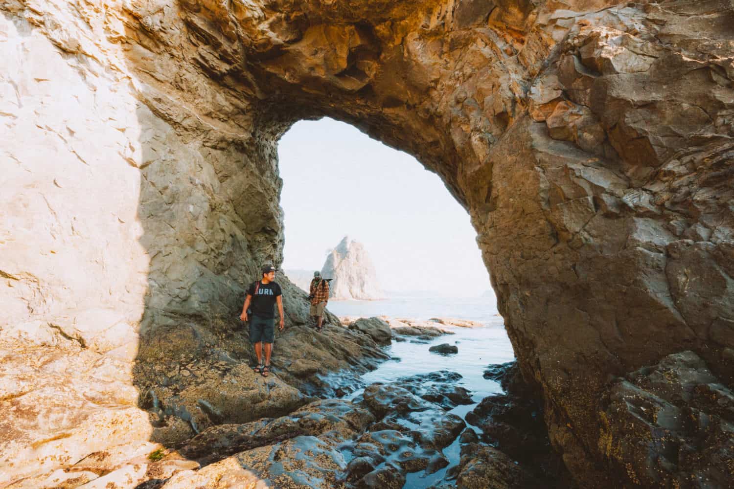 Walking through Hole In The Wall at Rialto Beach, Olympic National Park