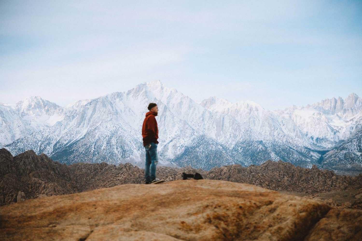 Man standing at Alabama Hills during sunrise