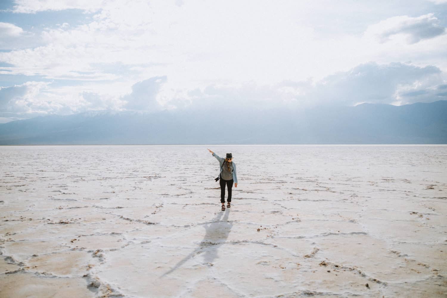 Emily Mandagie standing in Badwater Basin - Death Valley In One Day - TheMandagies.com