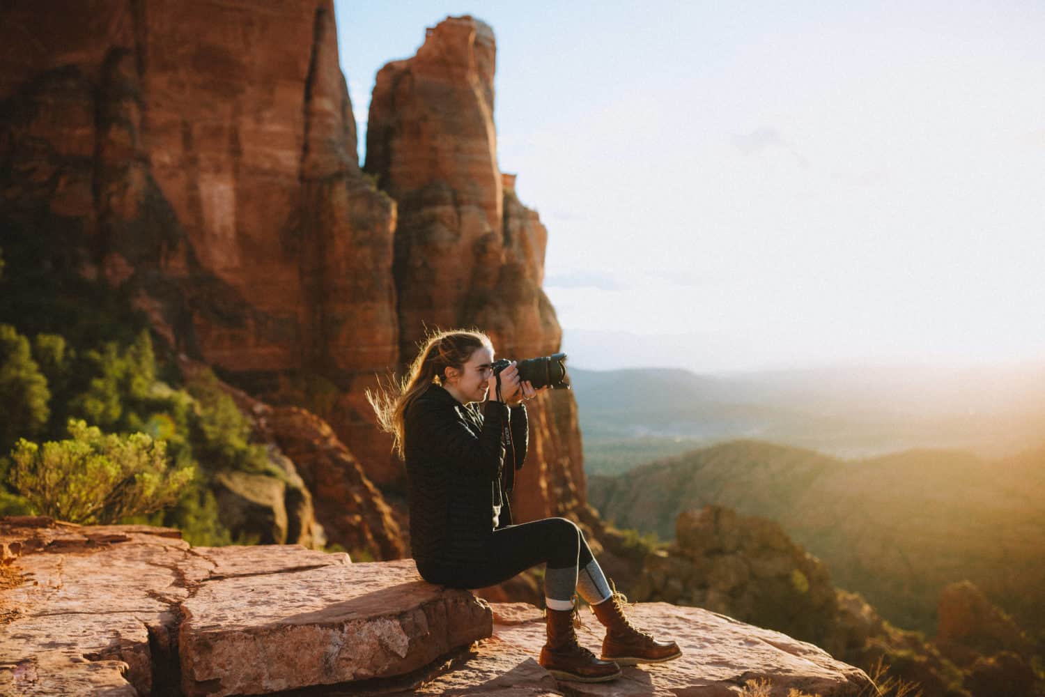 Emily taking a picture at Cathedral Rock, Sedona -TheMandagies.com