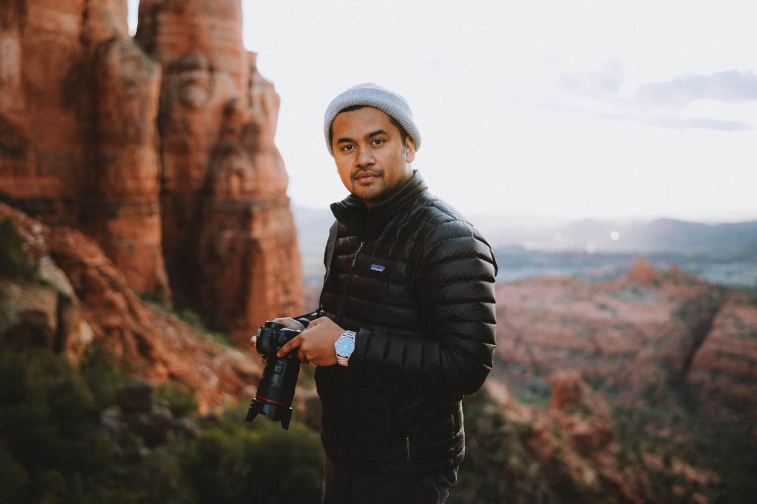 Berty Mandagie standing at top of Cathedral Rock Trail - TheMandagies.com