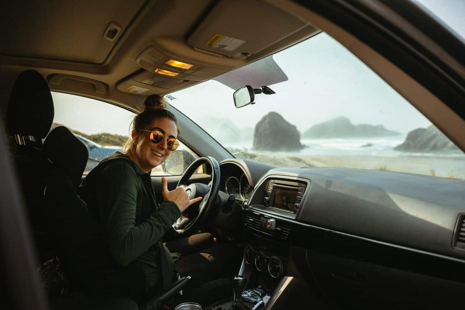 Emily Mandagie driving the Oregon Coast Highway 101