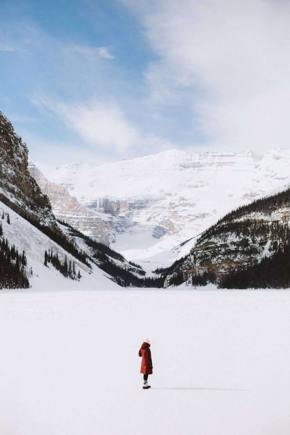 View of Frozen Lake Louise in Banff National Park - TheMandagies.com