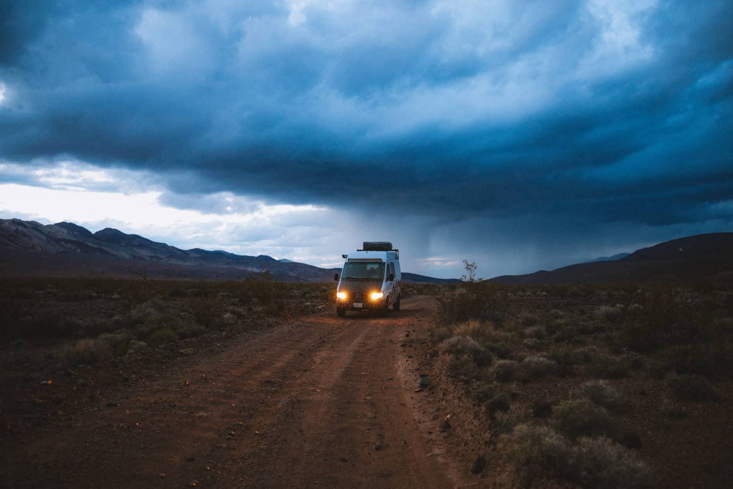 Finding a camping spot in Death Valley - sprinter van at sunset