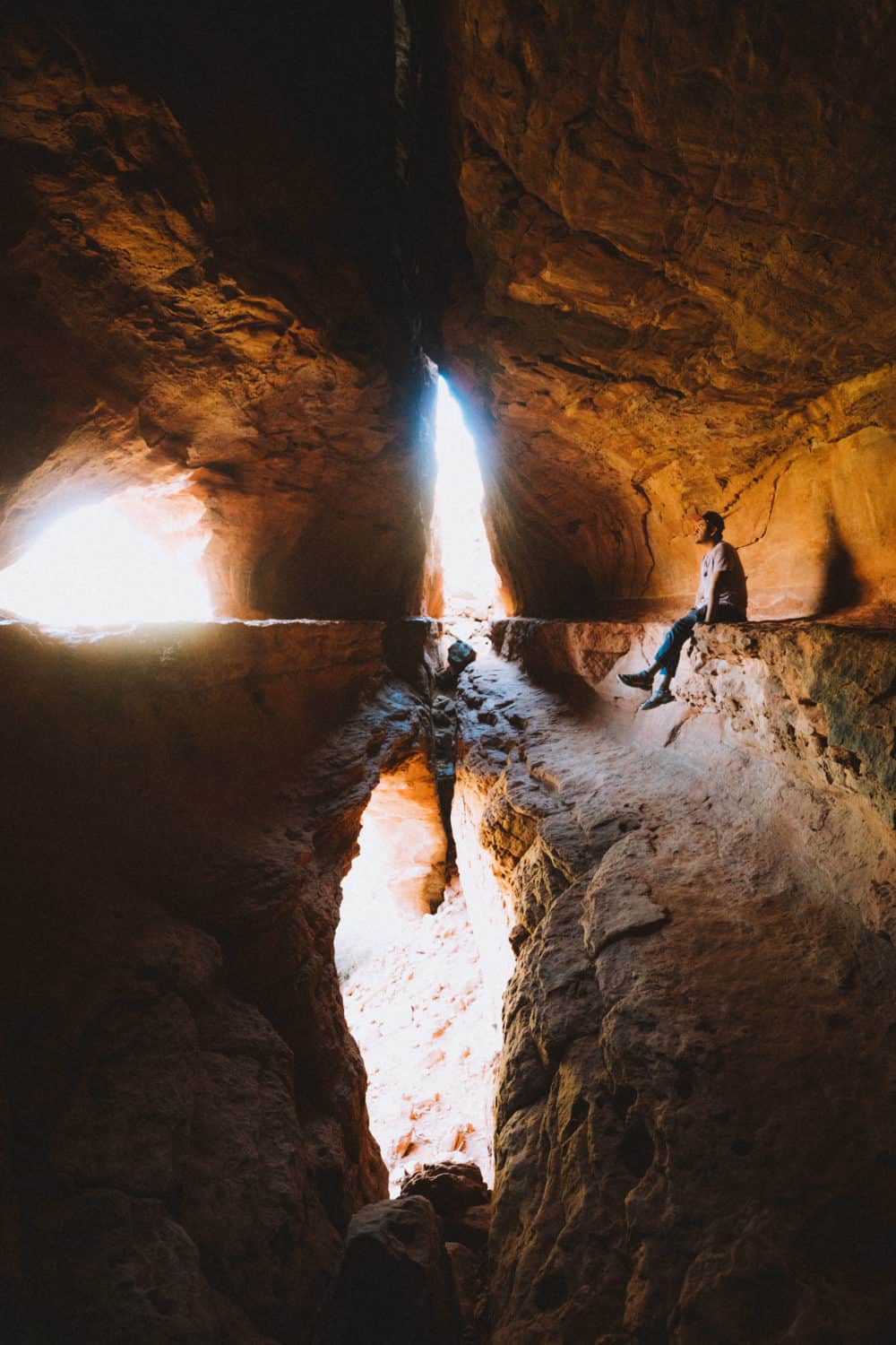 Berty Mandagie sitting in cave at Soldiers Pass Trail