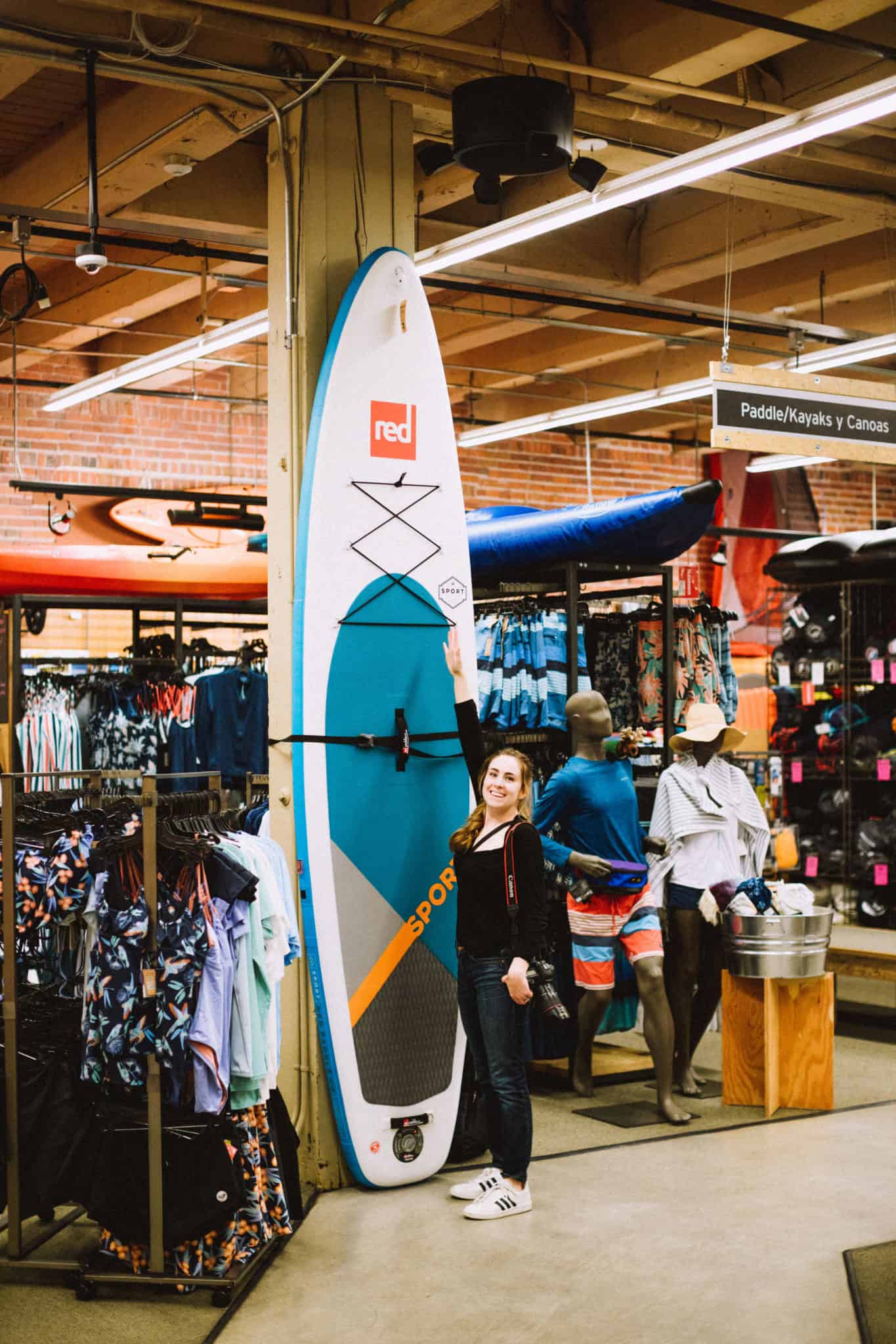 Emily Mandagie standing at RED Inflatable paddle boards