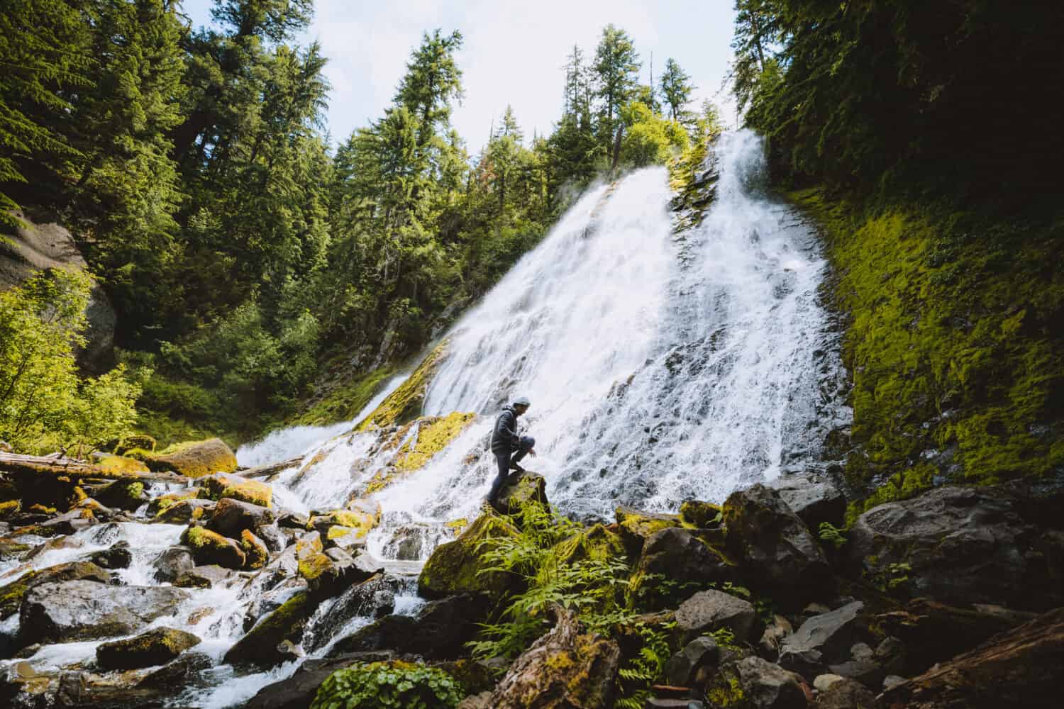 Berty standing at bottom of Diamond Creek Falls