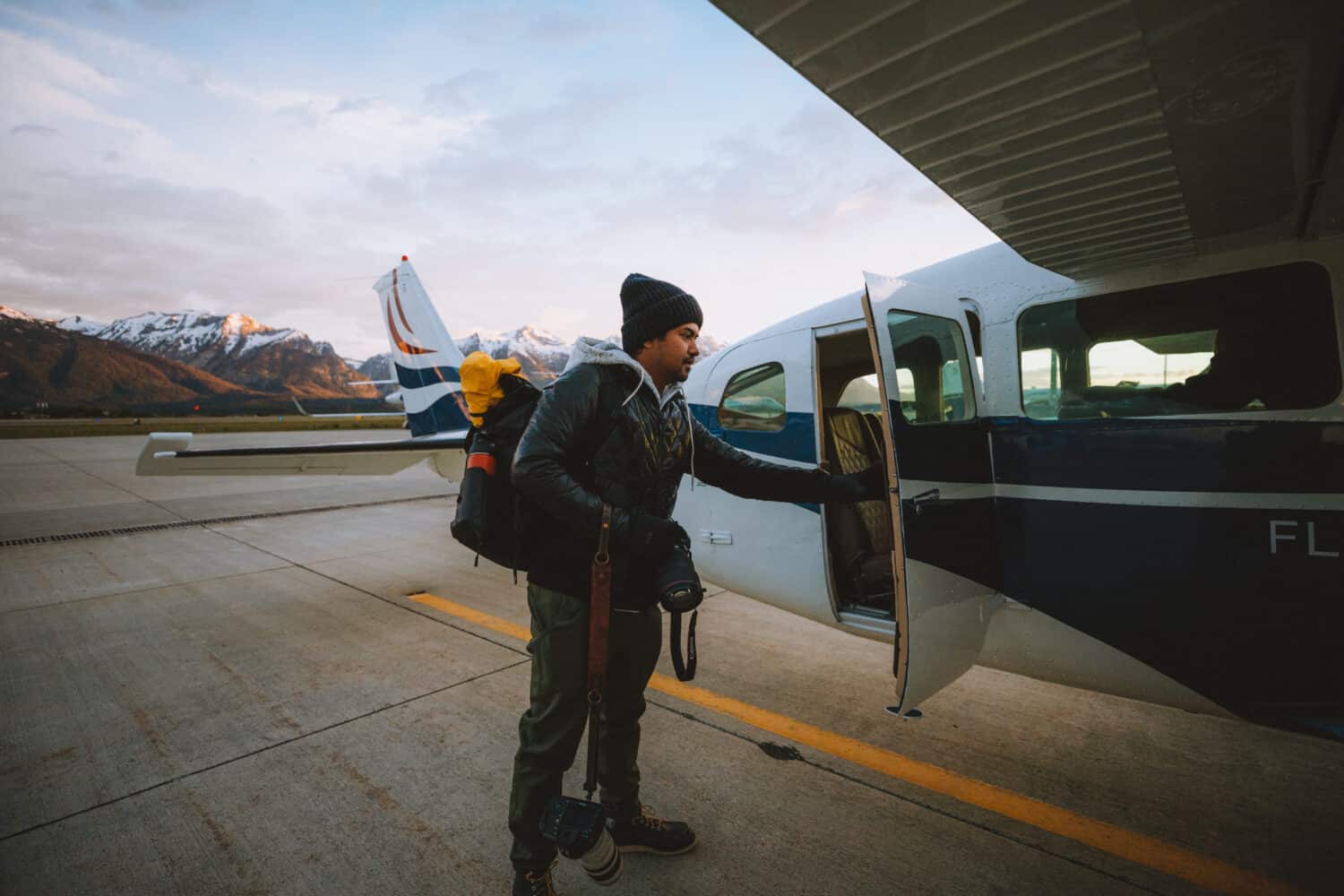 Berty entering plane at Fly Jackson Hole - TheMandagies.com