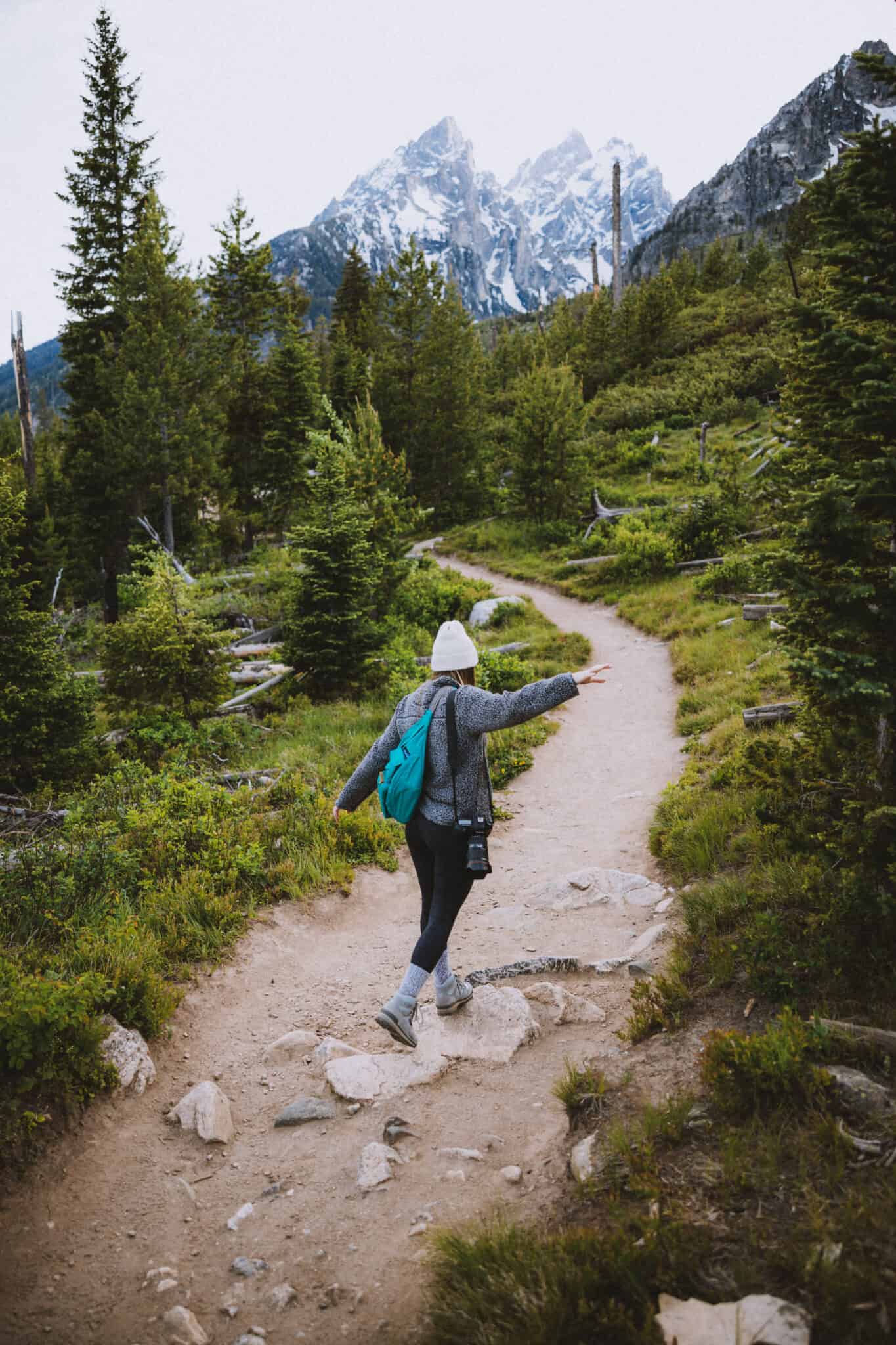 Emily Mandagie walking on String Lake Trail, - TheMandagies.com