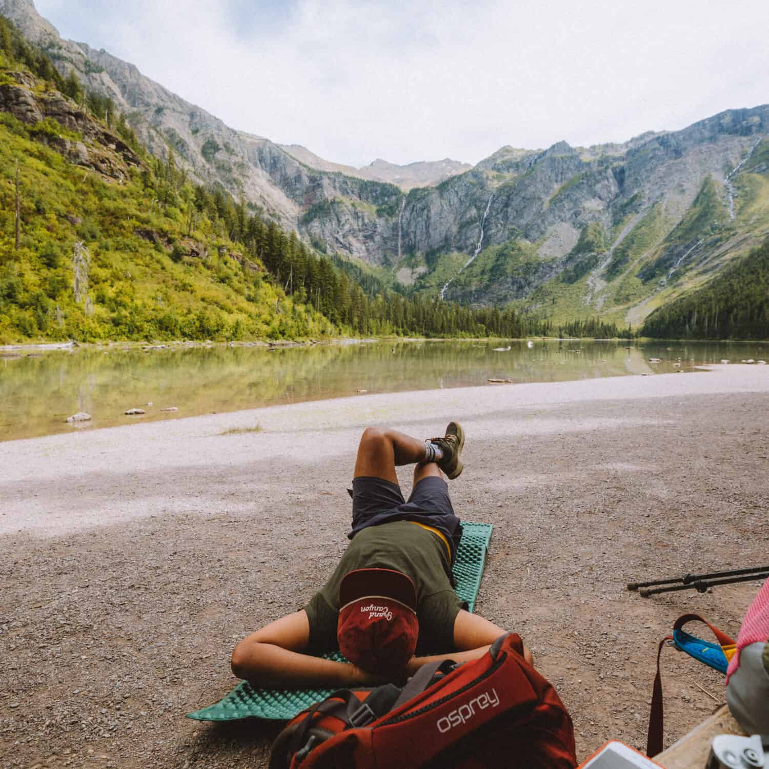 Berty Mandagie resting at Avalanche Hiking Trail in Glacier - TheMandagies.com