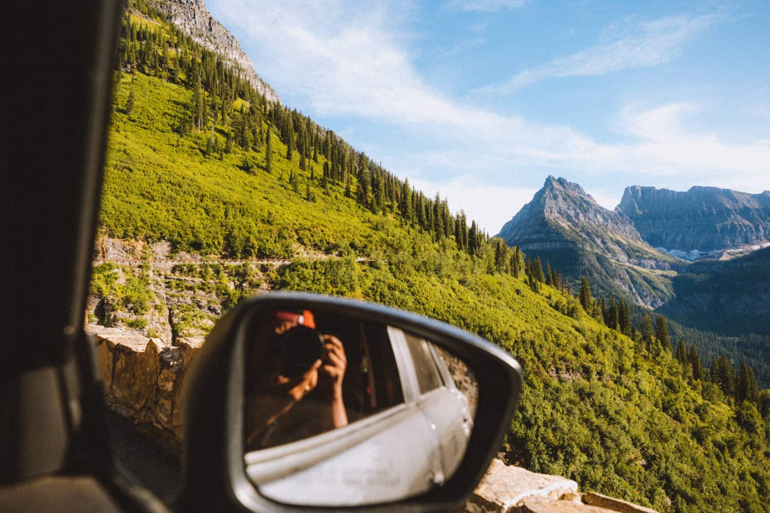 Berty taking a photo on Going To The Sun Road - TheMandagies.com