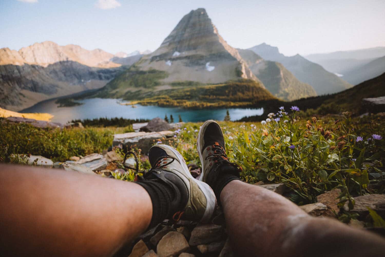 Shot of feet sitting with Hidden Lake Lookout in background