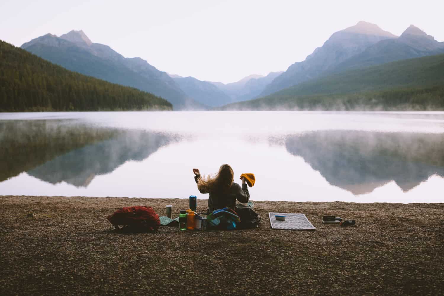 Emily watching reflection of Bowman Lake Montana