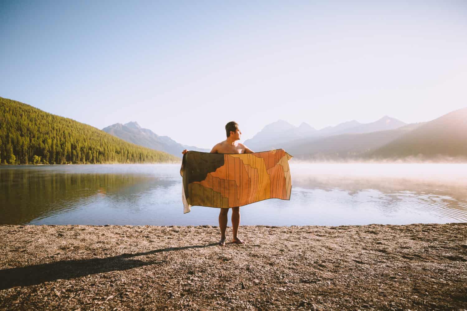 Berty Mandagie holding up towel