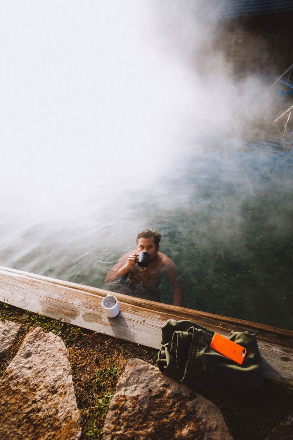 Berty Mandagie sipping coffee poolside at Burgdorf Hot Springs - TheMandagies.com