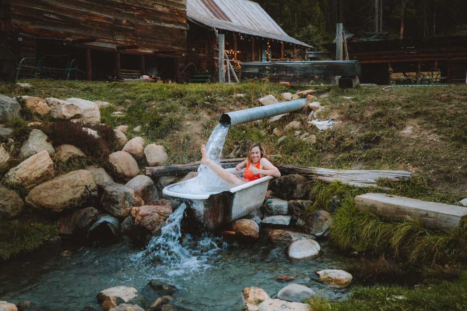 Emily Mandagie sitting in tub at Burgdorf Hot Springs