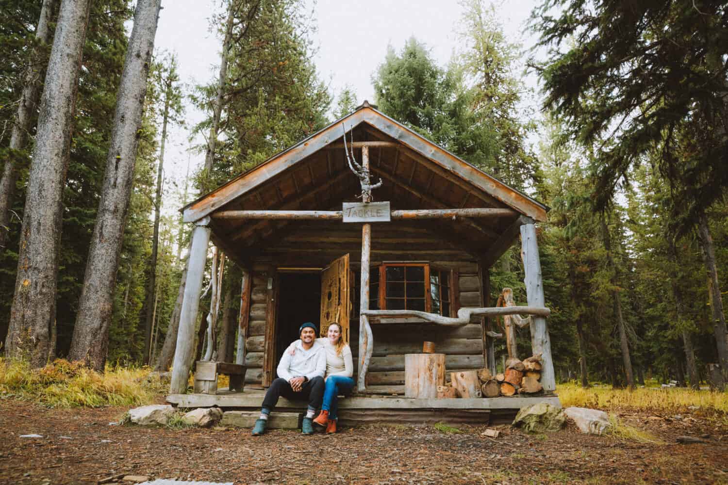 Berty and Emily Mandagie sitting outside cabin at Burgdorf Hot Springs, McCall Idaho - TheMandagies.com