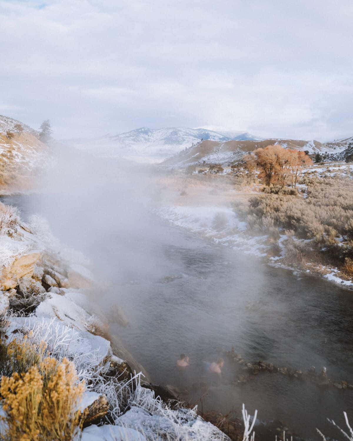 View of people soaking in the Boiling River - TheMandagies.com