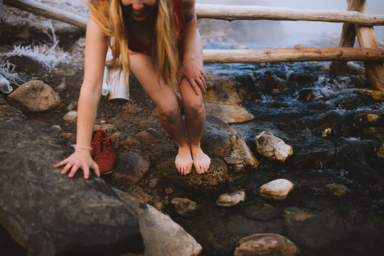 Stepping into the Boiling River in Yellowstone, Wyoming - TheMandagies.com