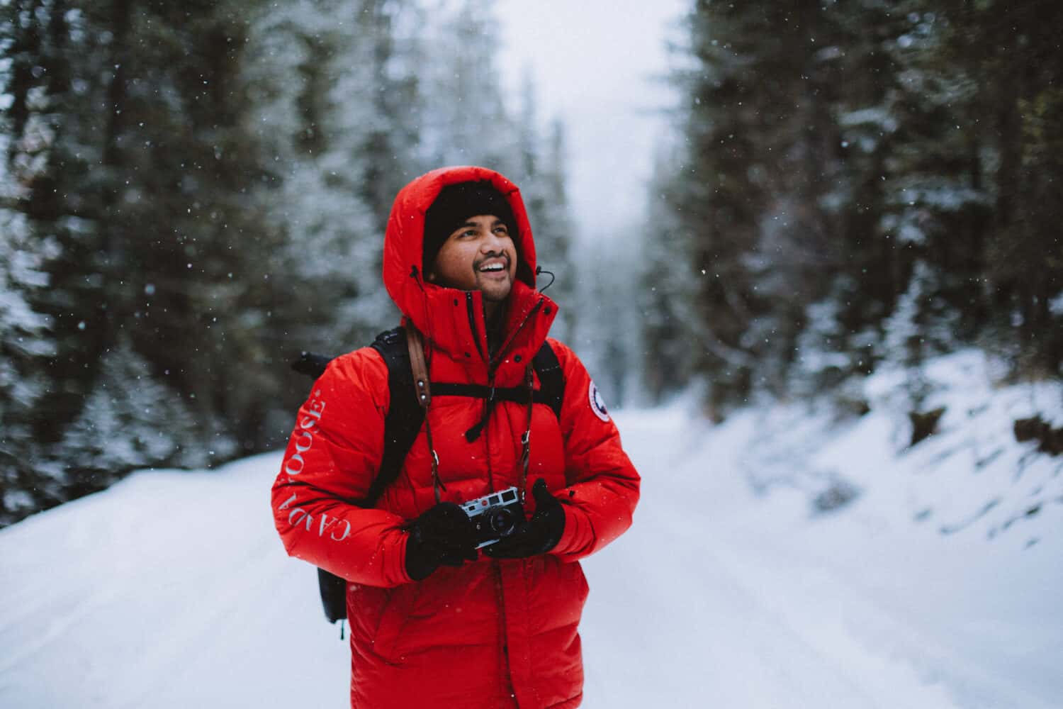 Berty Mandagie taking photos in the winter Leica Camera