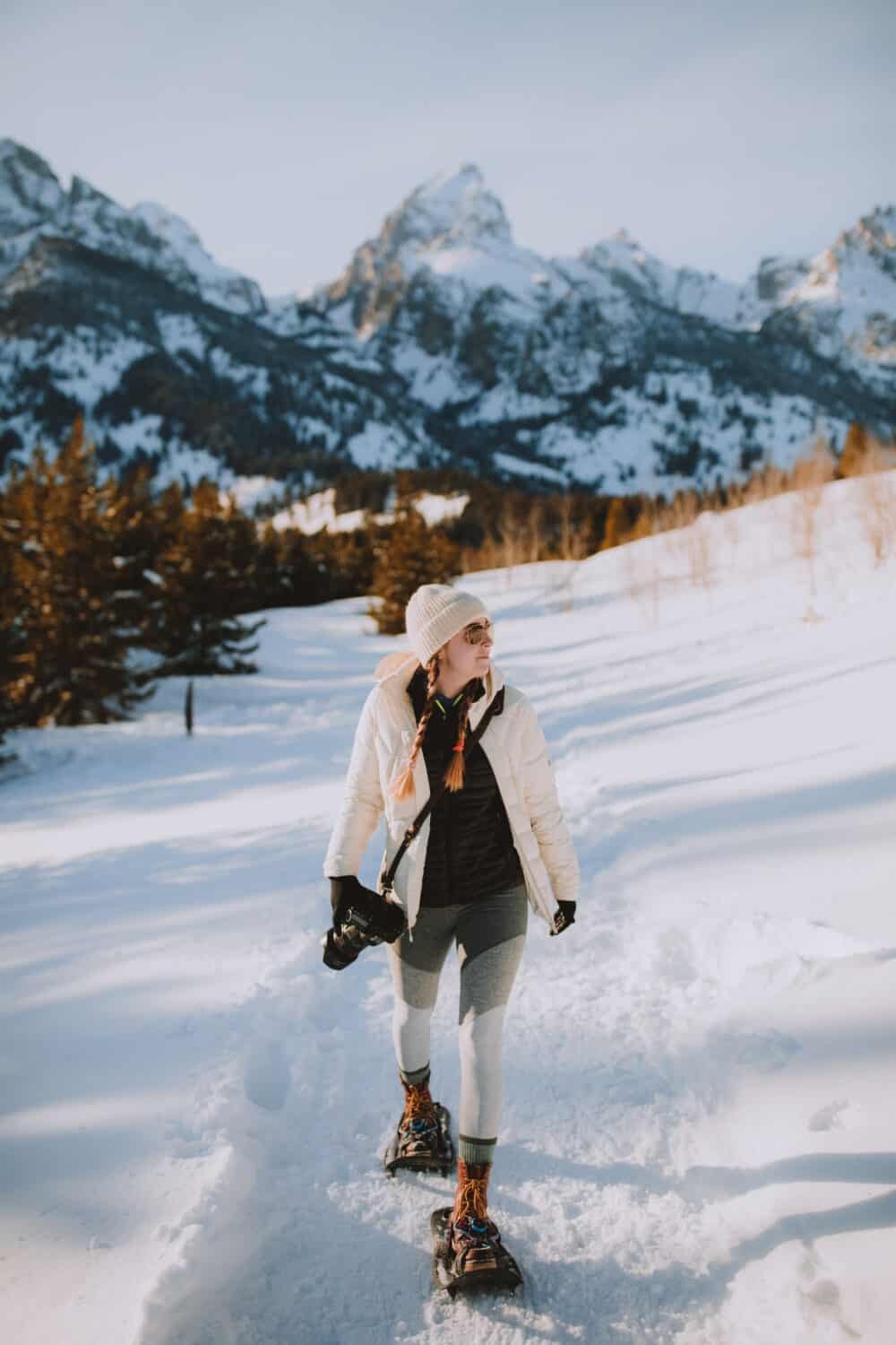 Emily Mandagie snowshoeing Taggart Lake Trail in Grand Teton National Park - TheMandagies.com