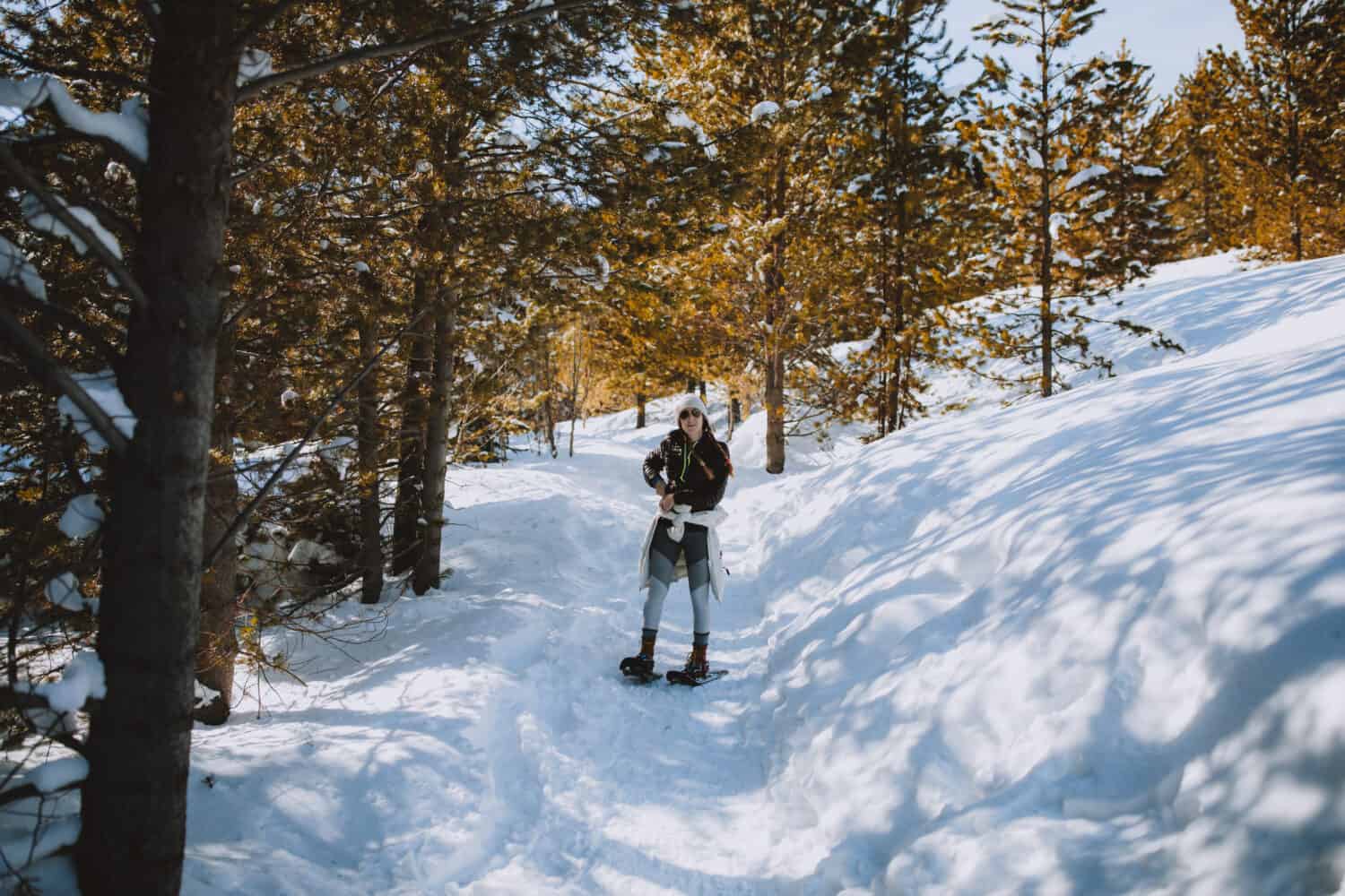 Emily Mandagie walking on Taggart Lake Trail in winter - TheMandagies.com