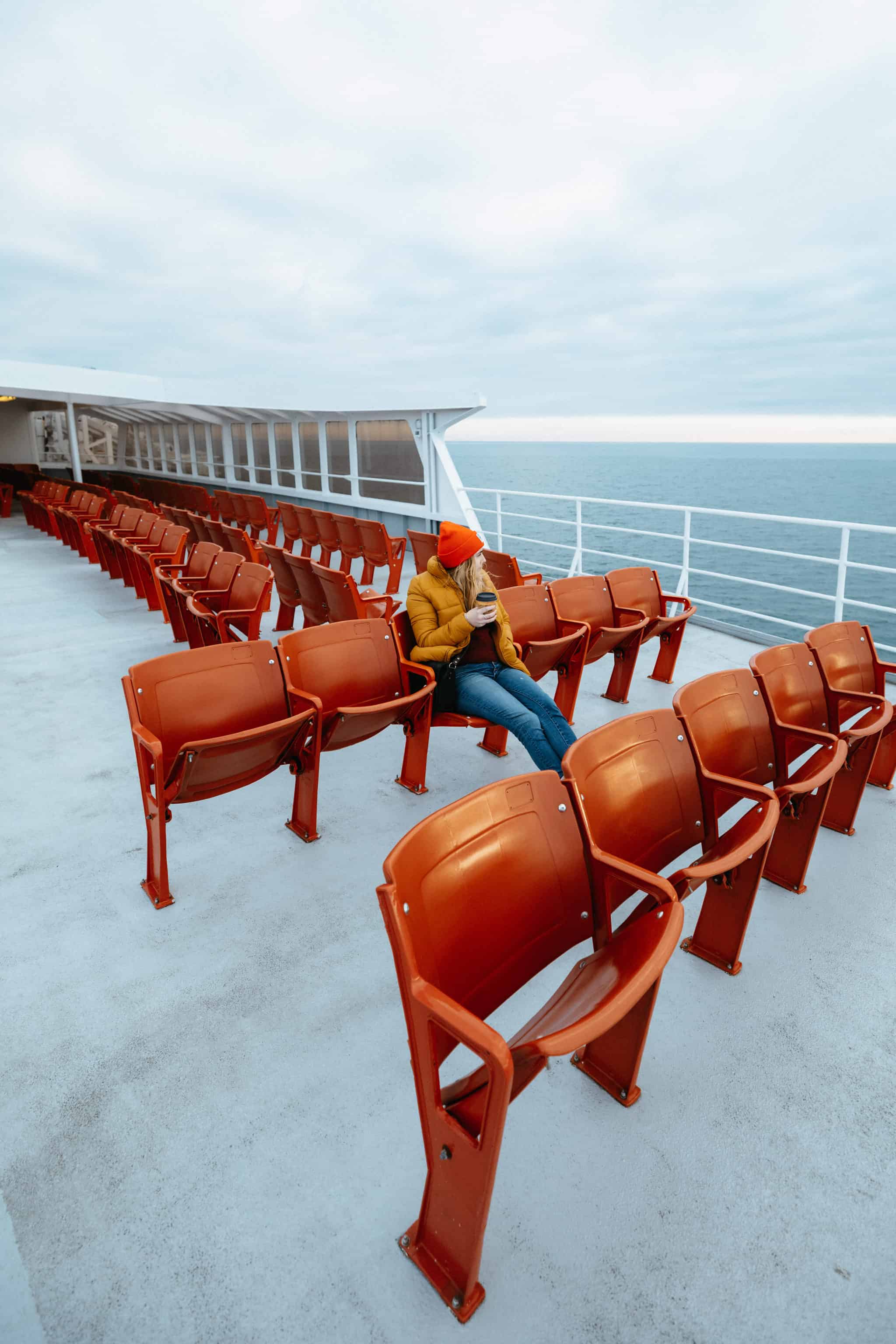 Emily Mandagie sitting on MV Coho Ferry Deck from Port Angeles, WA to Victoria, BC