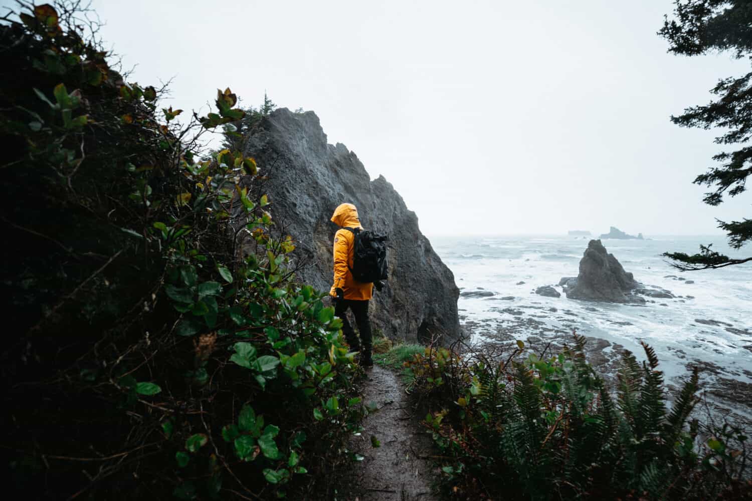 Berty Mandagie hiking on Rialto Beach Tail in January in Olympic National Park